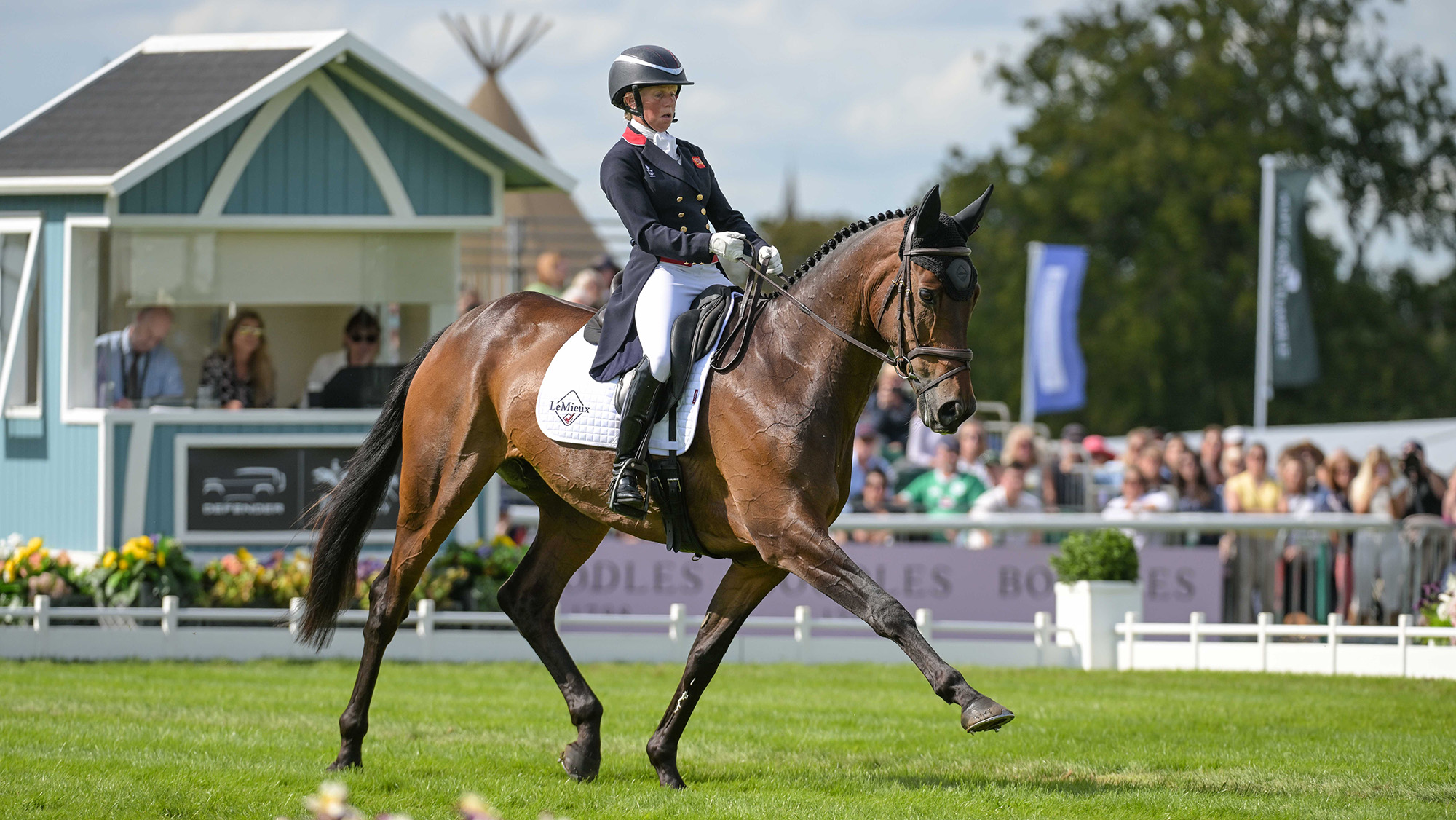 Ros Canter, a rider in a black tailcoat, rides bay horse Lordships Graffalo in the dressage at Burghley Horse Trials 2025