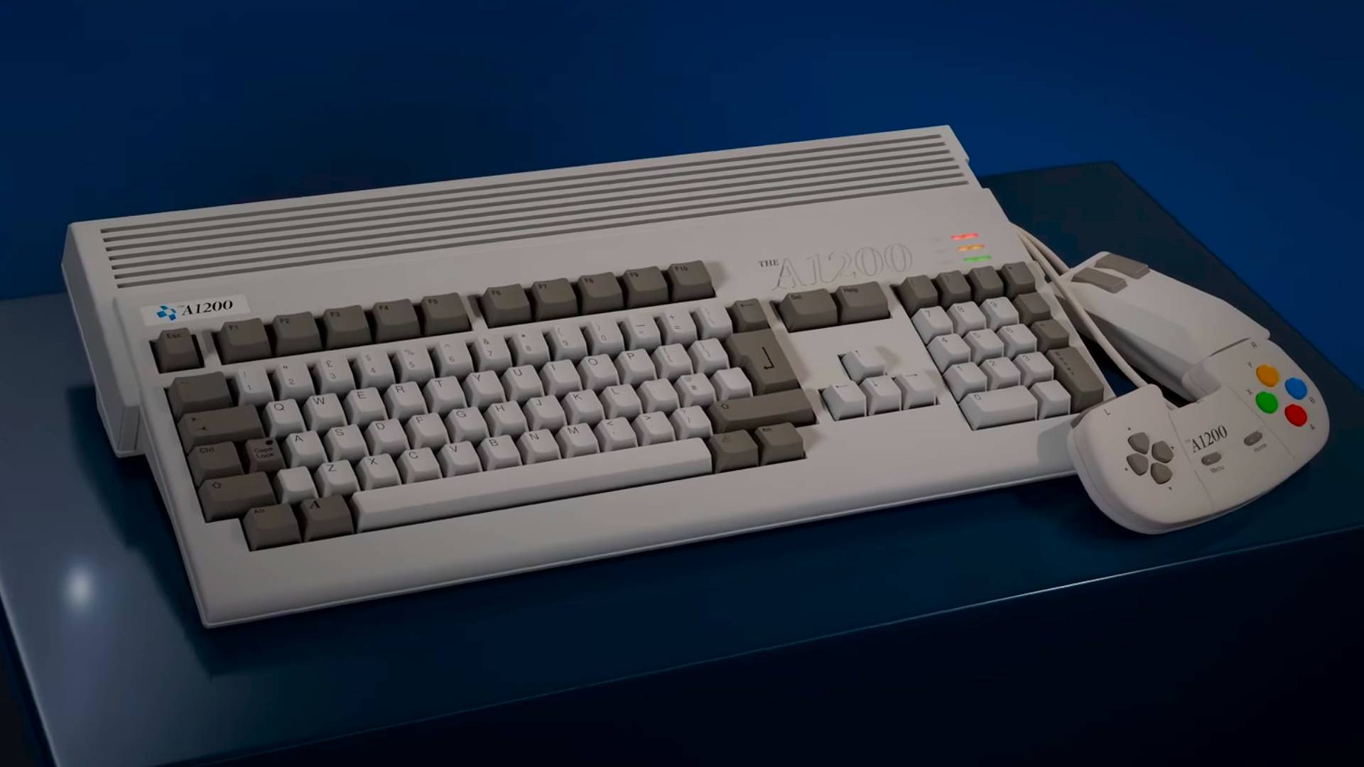 Amiga A1200 sitting on blue box next to mouse and controller.