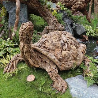 wooden tree tortoise in garden