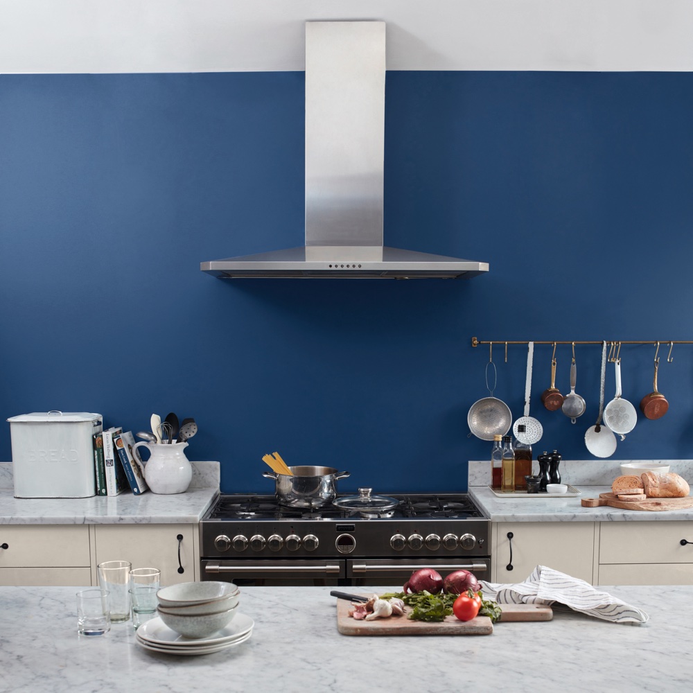kitchen area with extractor with marble countertop and cooker with oven