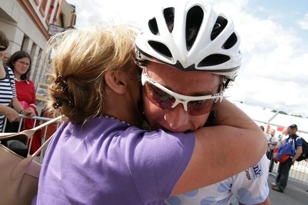 Sinki' gets a hug after winning stage three.