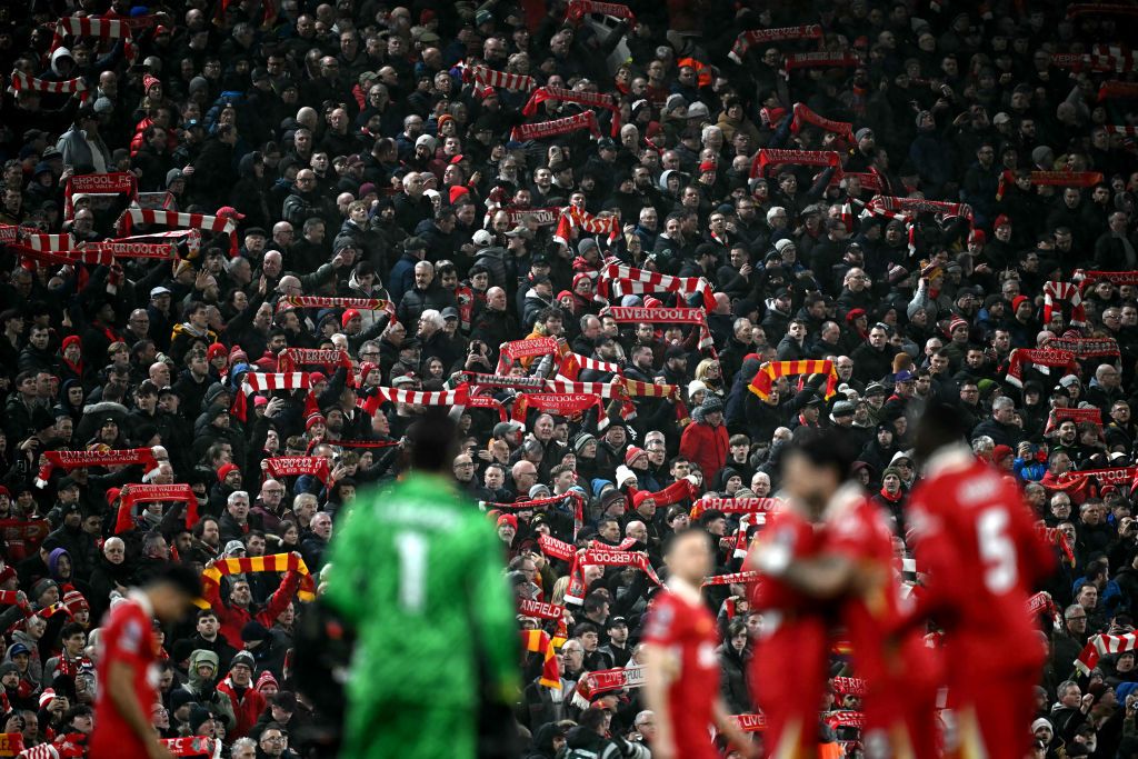 Fans hold scarves before the English Premier League football match between Liverpool and Newcastle United at Anfield in Liverpool, north west England on February 26, 2025.