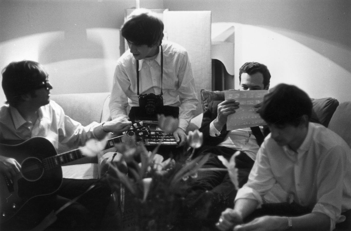 John Lennon (1940 - 1980), George Harrison (1943 - 2001) and Ringo Starr in Paris with their manager Brian Epstein.