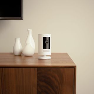 Ring security camera on wooden sideboard