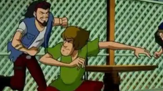 Shaggy fighting people in Scooby Doo! Legend of the Phantosaur.