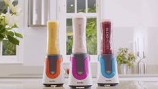 Three portable Breville blenders on a kitchen counter, demonstrating how to get the most out of a blender