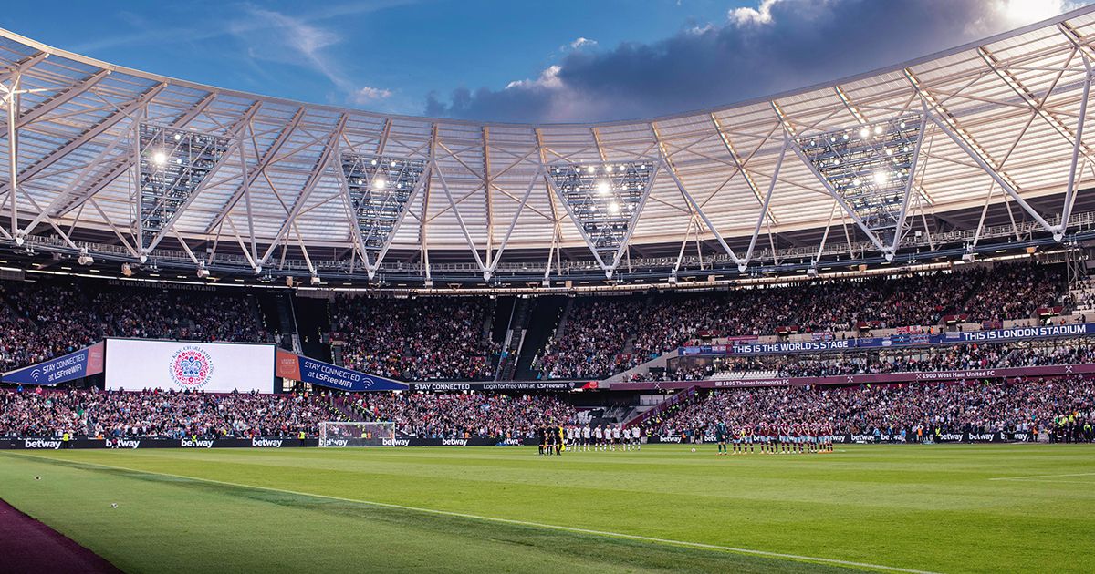 A general view inside the stadium as both sides stand for the national anthem for the Coronation of Charles III and Camilla prior to the Premier League match between West Ham United and Manchester United at London Stadium on May 07, 2023 in London, England.