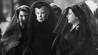 Left to right: Queen Elizabeth, Queen Elizabeth the Queen Mother, widow of King George VI, and Queen Mary at London King's Cross railway station for the arrival of the special train bringing the coffin of King George VI from Sandringham, 11th February 1952. The king's coffin will be drawn in procession to Westminster Hall, where it is to lie in state for three days before the funeral.