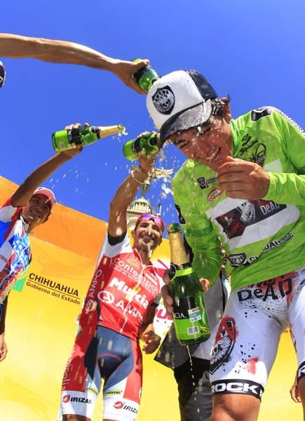 Rivals help Oscar Sevilla (Rock Racing) celebrate his overall win.
