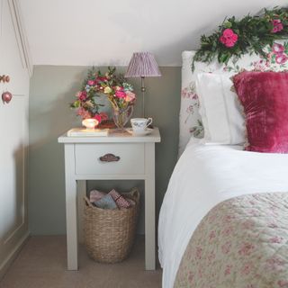 grade ll listed suffolk cottage bedroom with pink flowers and quilt
