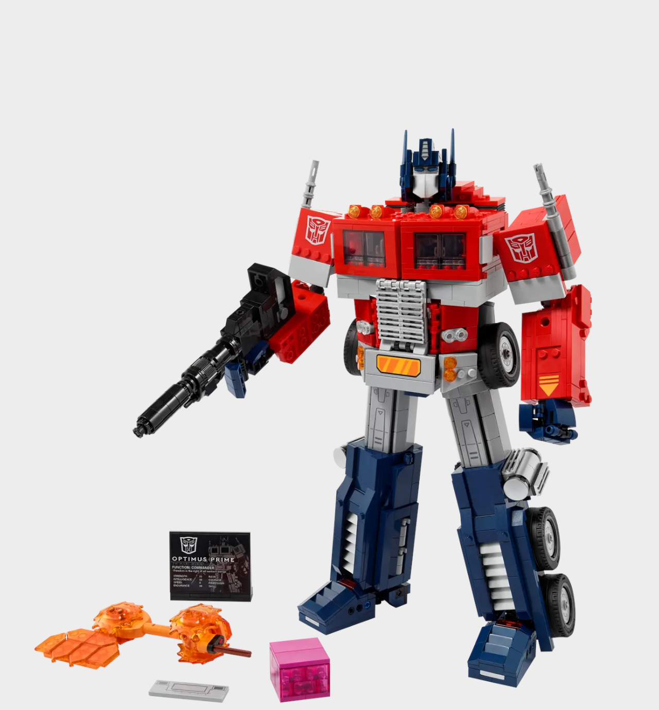 Lego Optimus Prime and accessories on a plain background