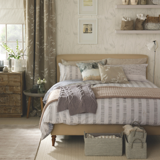 Neutral rustic bedroom with cozy throws