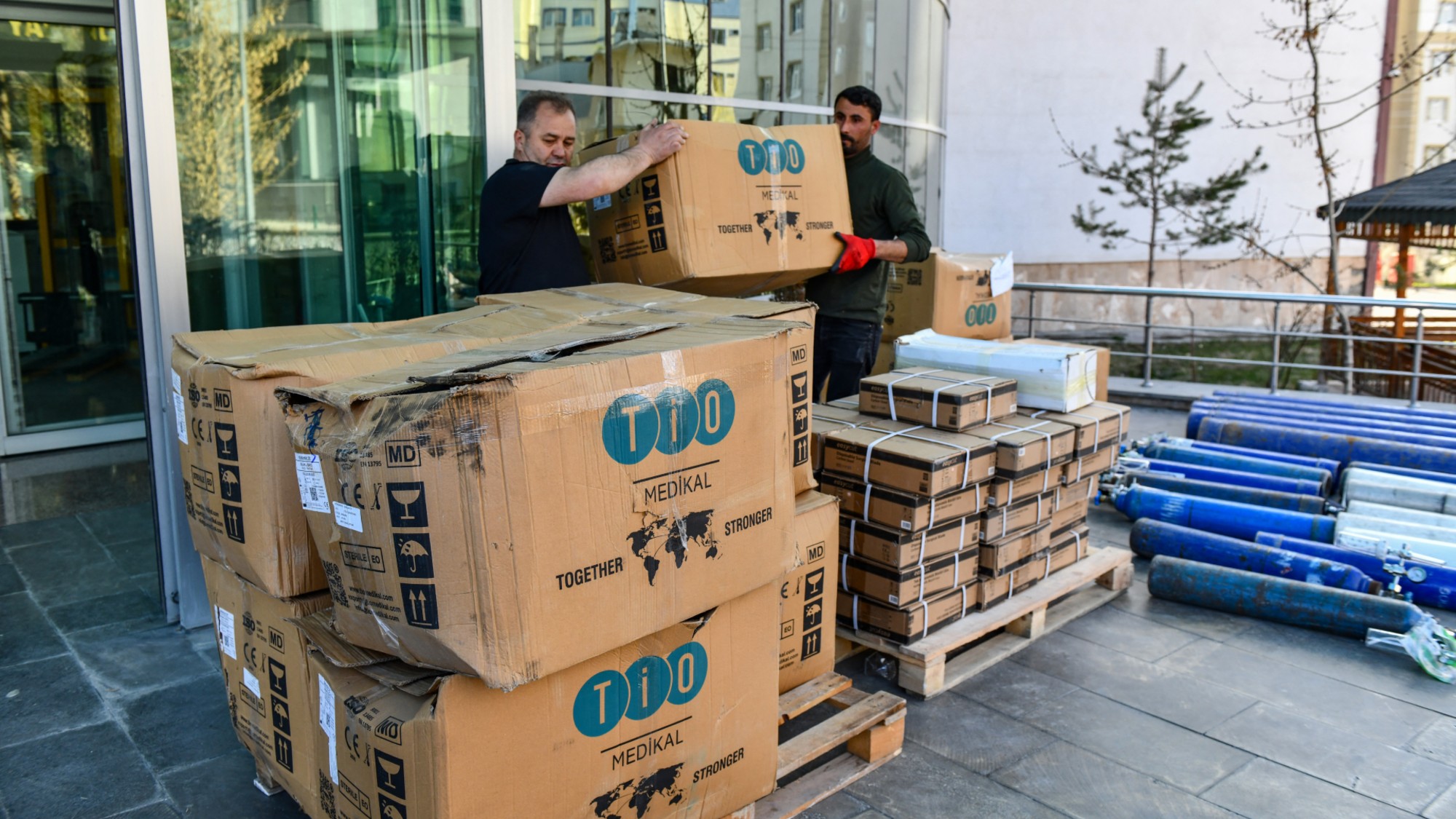 Workers in Turkey load medical supplies for shipment to Iran. 