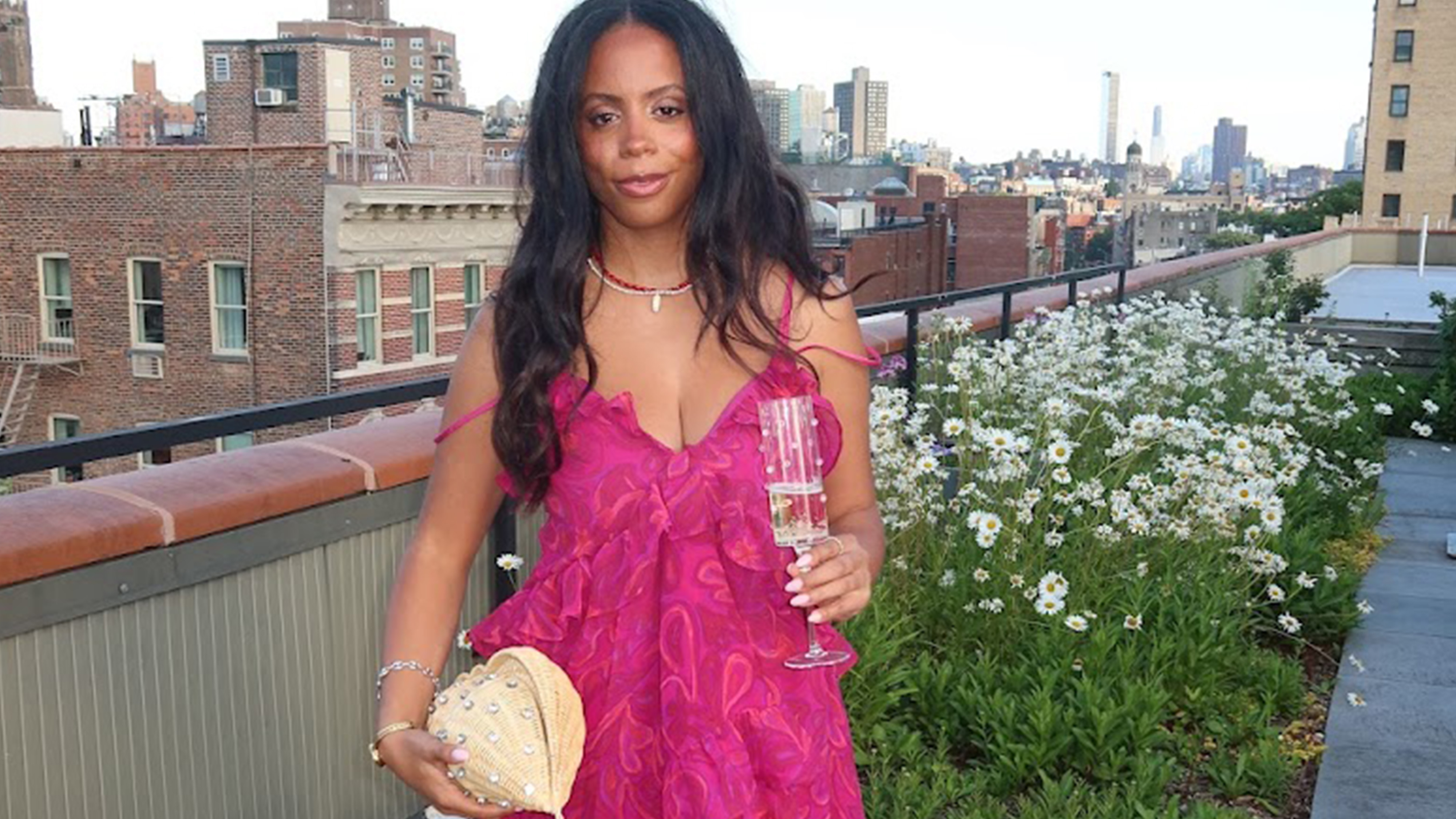 sierra mayhew wearing a wedding guest dress