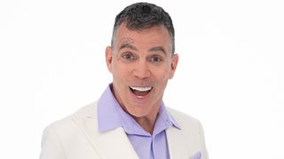 A close up of Steve-O smiling in front of a white background