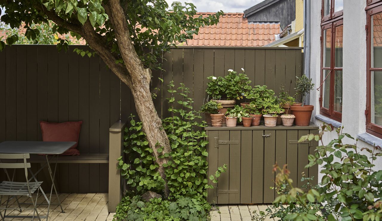 exterior fence and cupboard painted in Farrow &amp; Ball exterior paint