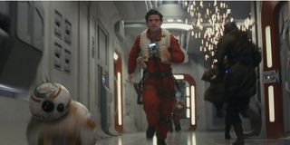 Oscar Isaac and BB8 running in Star Wars: The Last Jedi