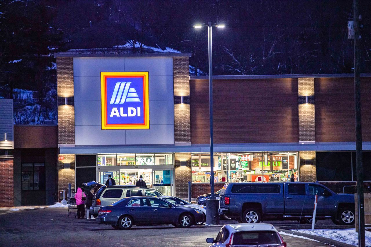 The exterior of an Aldi store at night in Athens, Ohio