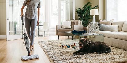 Image of Shark Genius Pocket Mop in lifestyle image being used on a carpet at home 