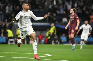 Real Madrid's French forward #09 Kylian Mbappe celebrates scoring the opening goal during the UEFA Champions League knockout phase play-off football match between Real Madrid CF and Manchester City at the Santiago Bernabeu stadium in Madrid on February 19, 2025.