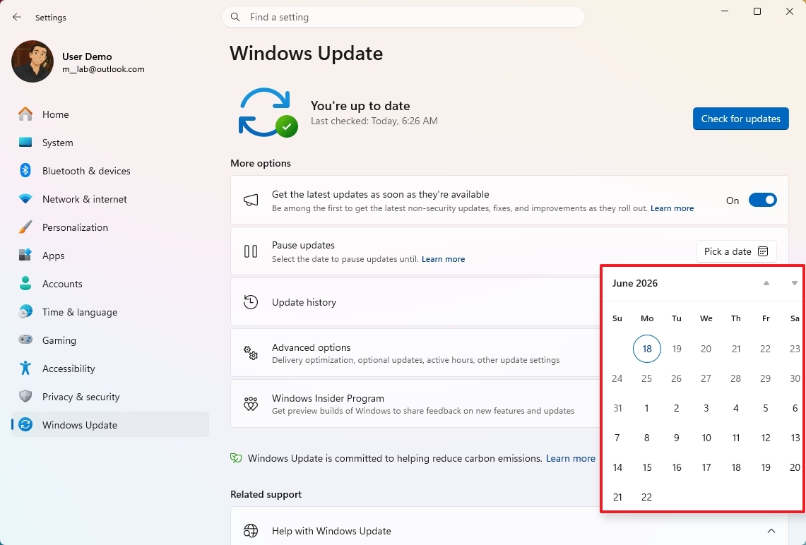 Windows Update settings screen showing updates are up to date. A calendar for June 2026 is highlighted, showing the 18th selected.
