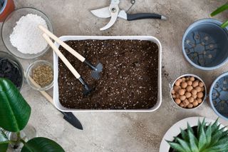 soil being prepared with amendments for houseplants