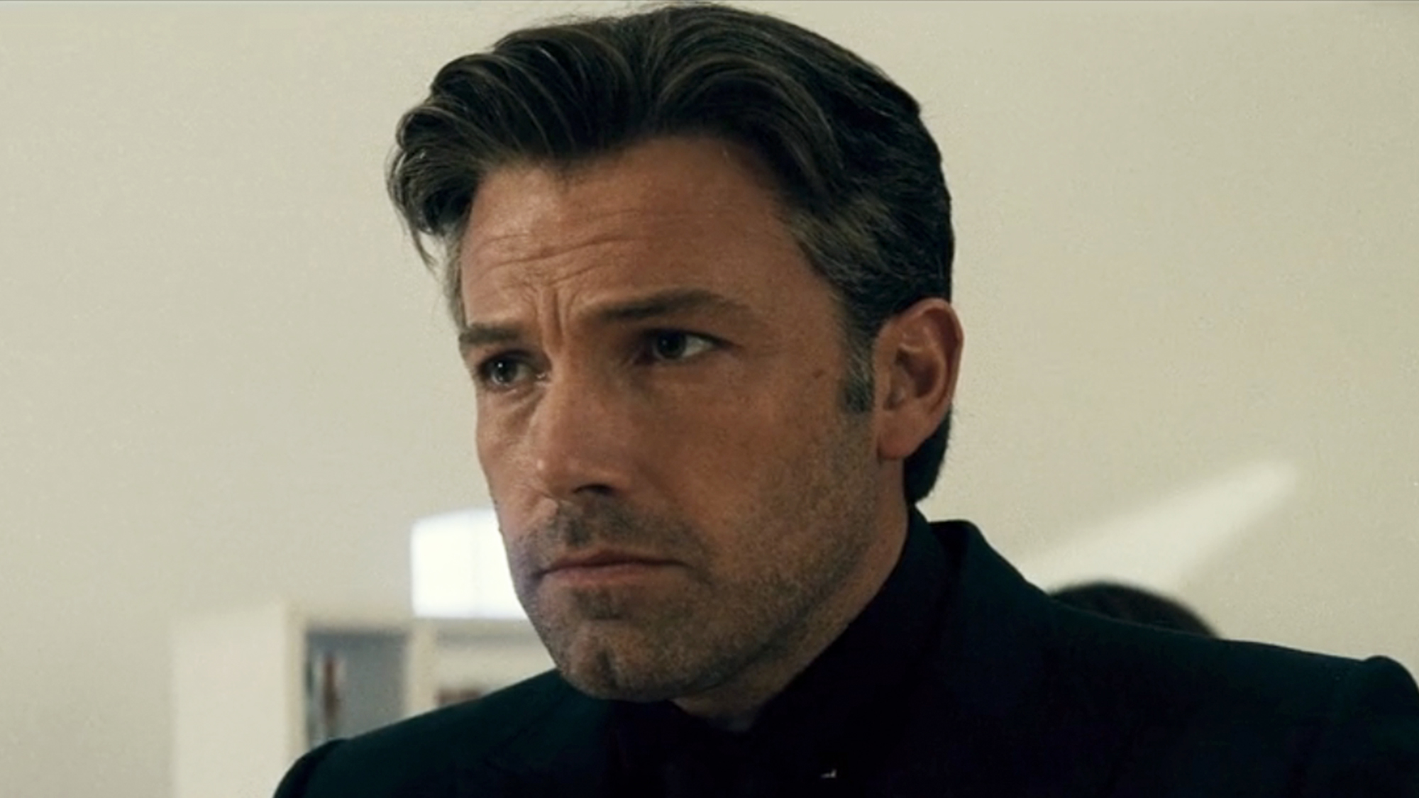 A close up of Ben Affleck in all black as Bruce Wayne in Batman v Superman: Dawn of Justice