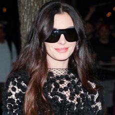 Anne Hathaway wore a naked Calvin Klein dress with a small Longchamp bag