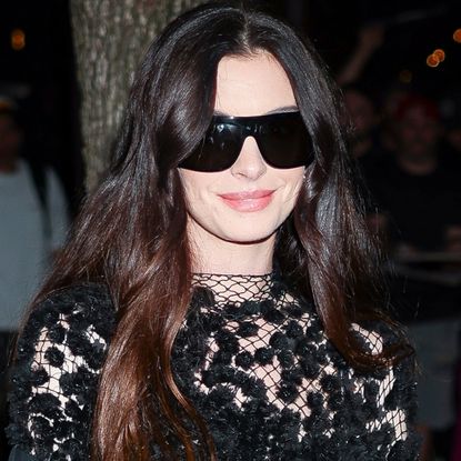 Anne Hathaway wore a naked Calvin Klein dress with a small Longchamp bag