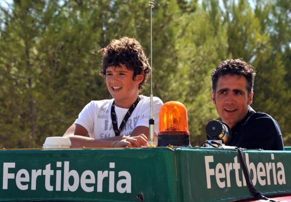 Miguel Indurain and, judging by the eyebrows, his son, in the lead car.
