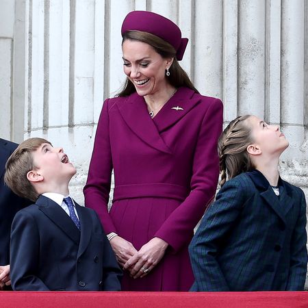 LONDON, ENGLAND - MAY 05: (L-R) Prince George of Wales, Prince Louis of Wales, Catherine, Princess of Wales and Princess Charlotte of Wales watch the fly-past on the balcony of Buckingham Palace whilst watching a fly-past during the military procession to mark the 80th anniversary of VE Day on May 05, 2025 in London, England. The King and Queen, joined by Members of the Royal Family, will take part in events from May 5th to May 8th to commemorate the 80th anniversary of VE Day, which signalled the end of the Second World War in Europe. (Photo by Chris Jackson/Getty Images)