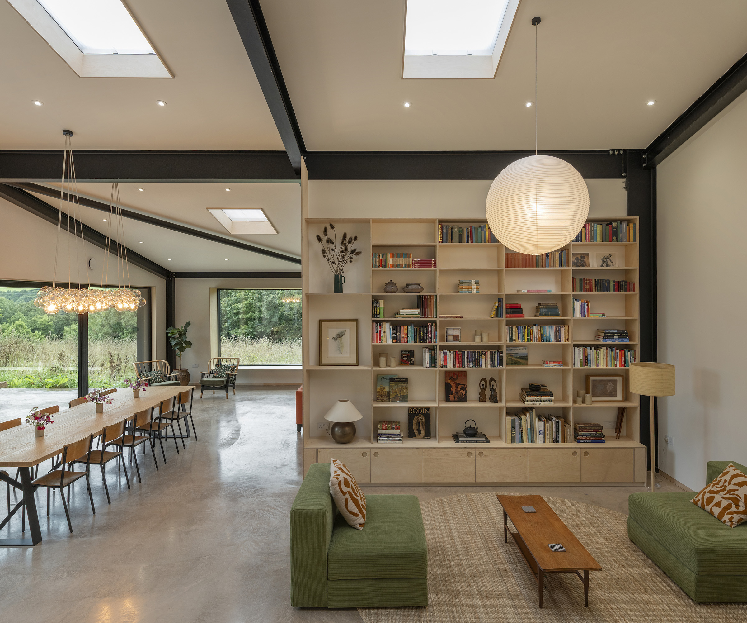 Open plan living room, dining room in a large interior space inside a barn conversion