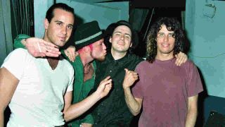 Stone Temple Pilots’ Scott Weiland, Robert DeLeo and Dean DeLeo posing for a casual photograph in 1993