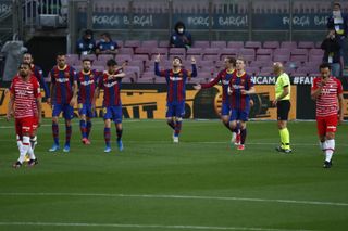 Lionel Messi, centre, put Barcelona ahead but Granada hit back