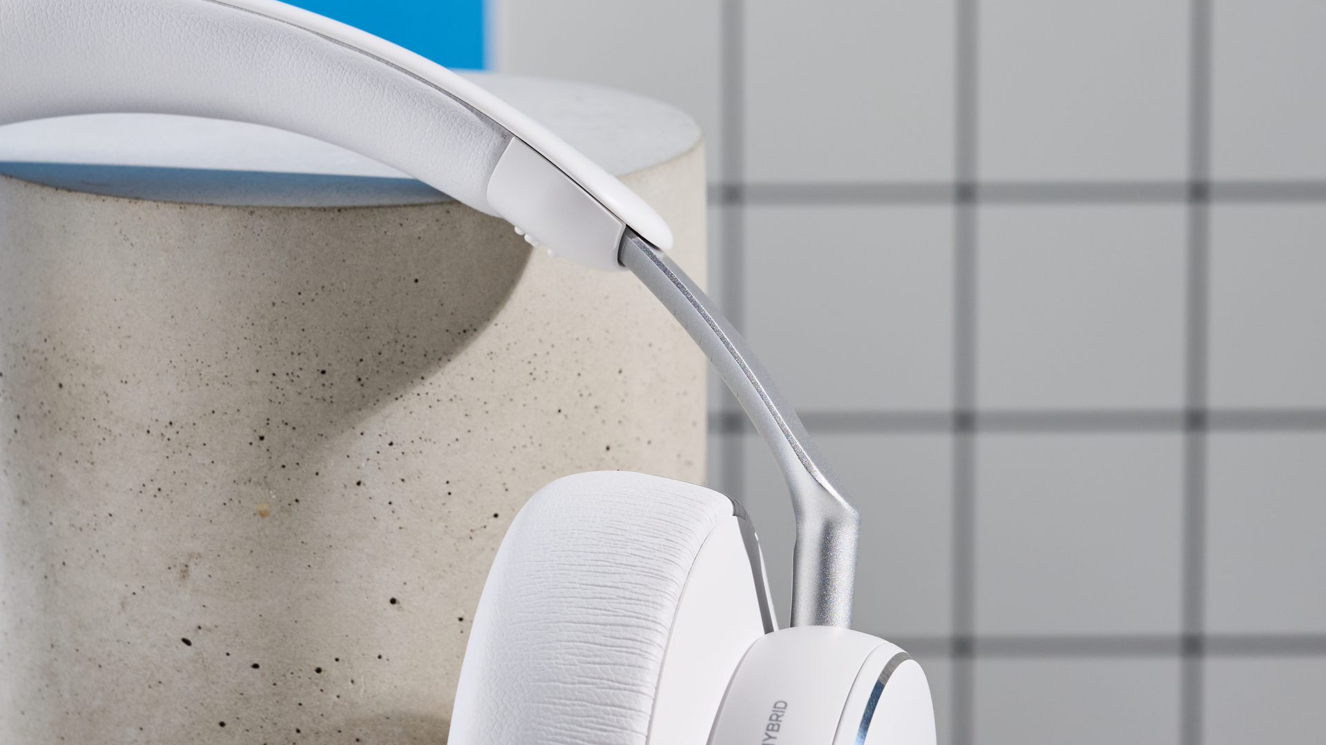 The AKG N9 Hybrid headphones photographed in front of a blue background.