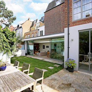 The living space off the kitchen opens out onto a small, but perfectly formed garden area