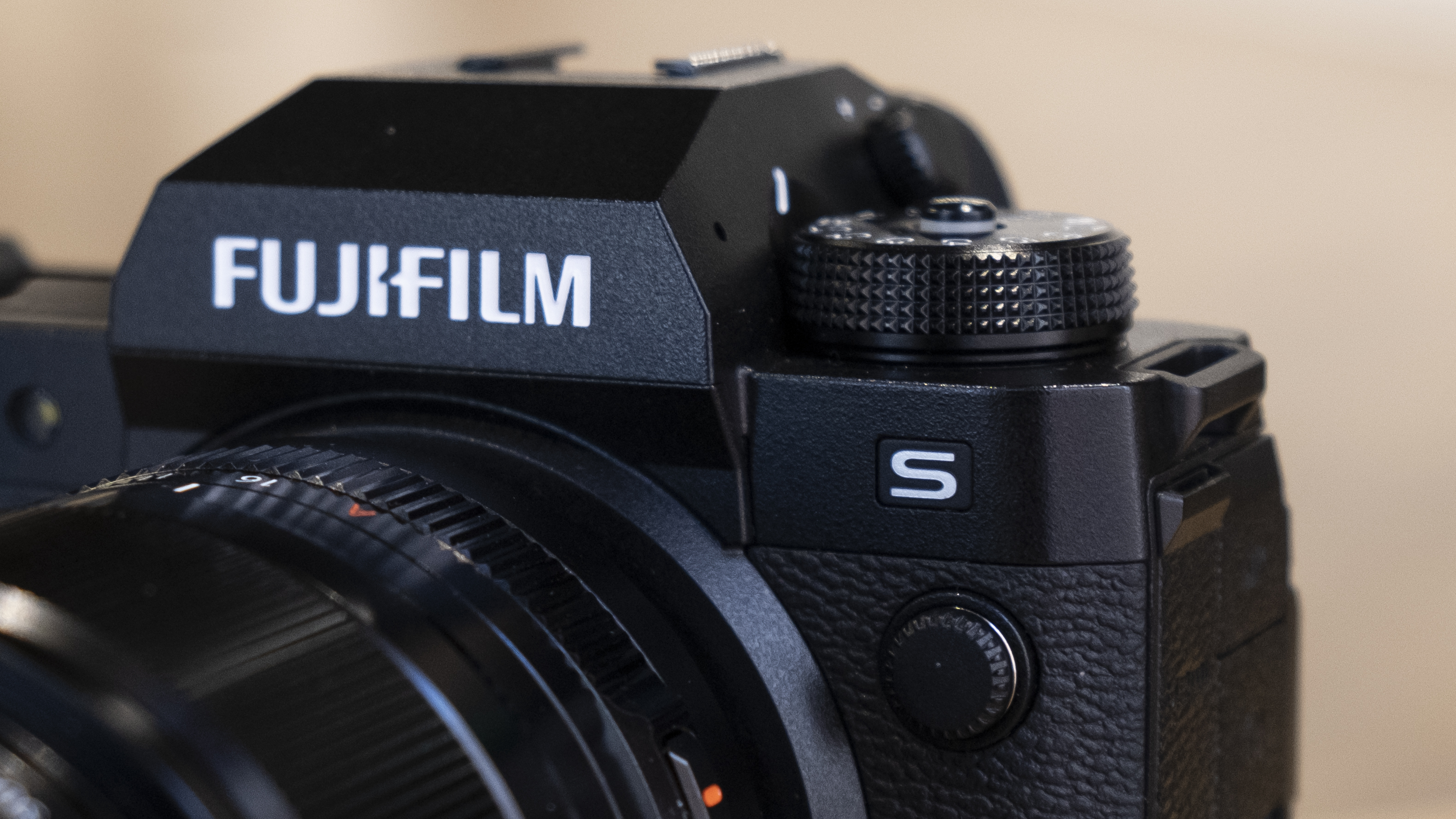 The Fujifilm X-H2S camera on a wooden table