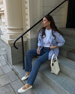 woman wearing denim and button down with flats