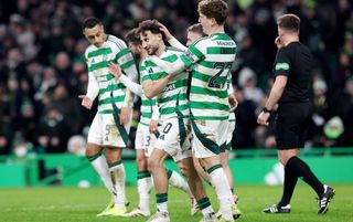 GLASGOW, SCOTLAND - JANUARY 05: Nicolas Kuehn of Celtic celebrates with teammates after scoring his team's third goal during the William Hill Premiership match between Celtic FC and St. Mirren FC at Celtic Park on January 05, 2025 in Glasgow, Scotland. (Photo by Ian MacNicol/Getty Images)