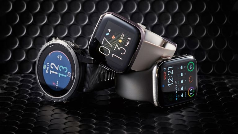 A collection of the best smartwatches on a black background, including the Apple Watch, Fitbit Sense and Garmin Fenix
