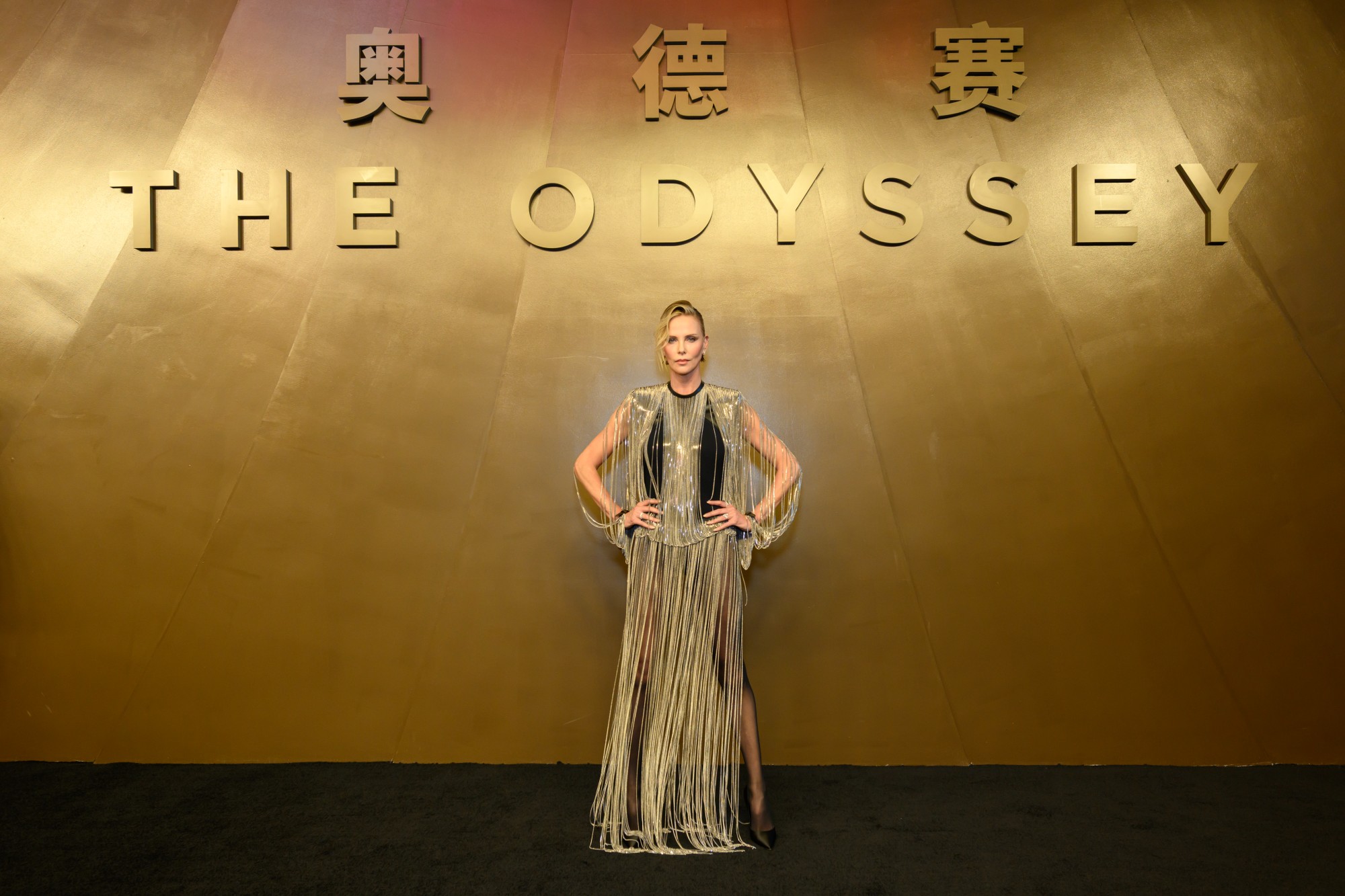 Charlize Theron wears a silver fringe dress and attends THE ODYSSEY China Premiere at the China National Film Museum on July 30, 2026 in Beijing, China.