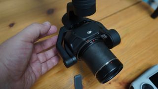DJI Inspire 3 Zenmuse camera close up with 35mm lens and hand