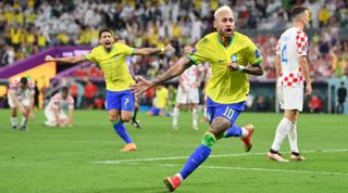 Neymar of Brazil celebrates after scoring the team's first goal during the FIFA World Cup Qatar 2022 quarter final match between Croatia and Brazil at Education City Stadium on December 09, 2022 in Al Rayyan, Qatar.