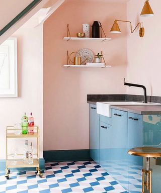 A high-contrast pink and blue kitchen with geometric patterned floor using Inchyra Blue and Pink Ground