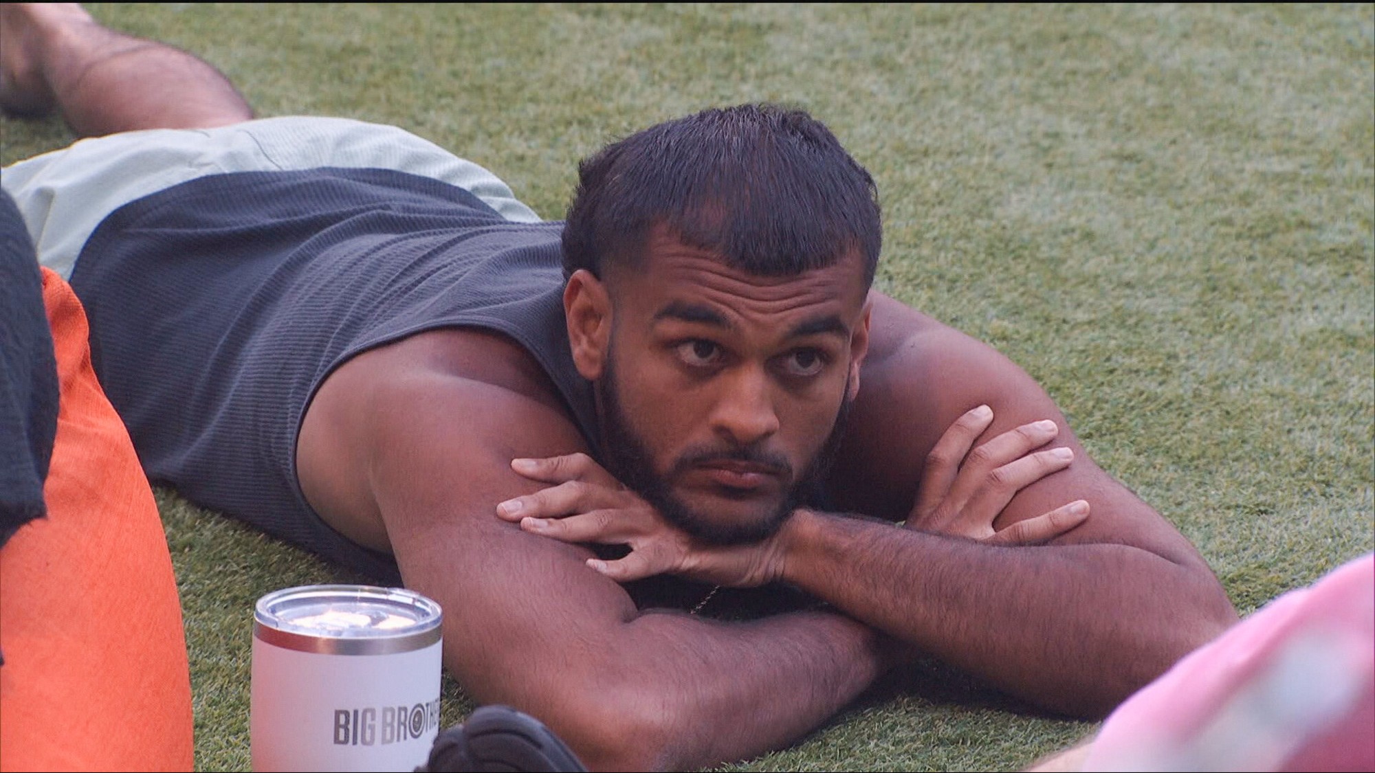 Yash laying on his stomach outside.