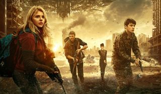 The 5th Wave Chloe Grace Moretz flees, gun in hand, with other humans