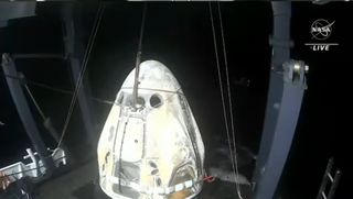 SpaceX Crew-5 Dragon Endurance sits on its recovery ship after splashing down in the Gulf of Mexico off the coast of Tampa Bay, Florida on March 11, 2023.