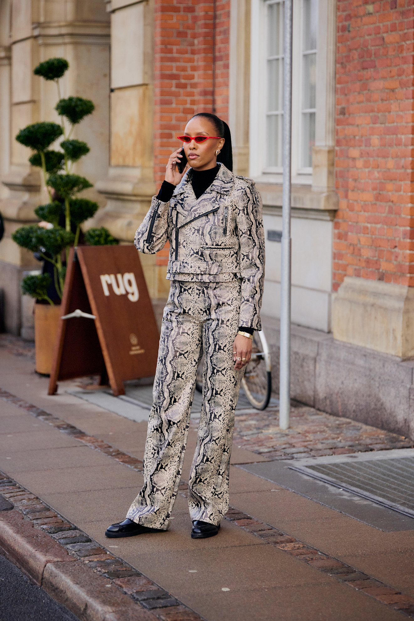 woman wearing full snakeskin in copenhagen