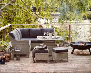 fire pit and rattan sofa on deck from dobbies