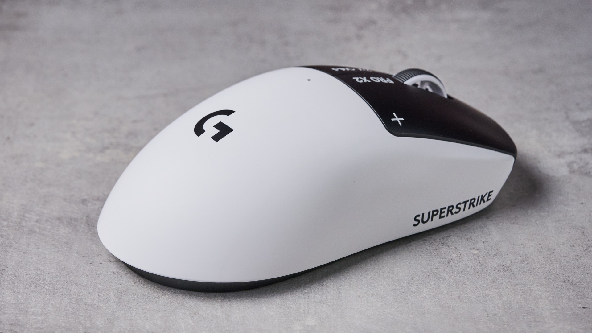 Rear three-quarter view of Logitech G Pro X2 Superstrike on white desk